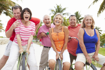 Group of senior friends having fun on bicycle ride